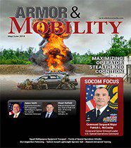A magazine cover with an image of a military vehicle.