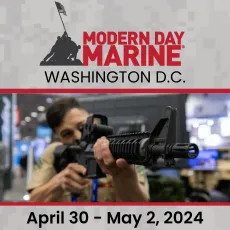A woman holding an ar-1 5 rifle in front of the modern day marine logo.