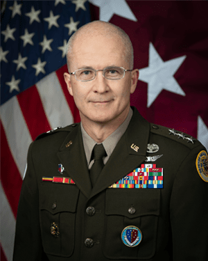A bald man in a military uniform.