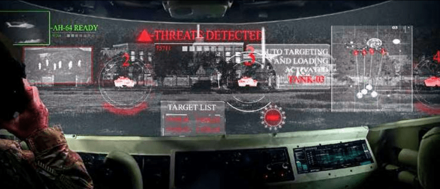 Military personnel analyzing threat detection interface inside a vehicle.