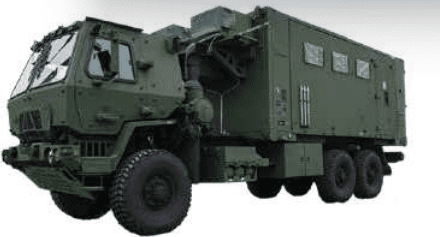 Military truck with a large container unit on the back.